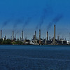 Chemical Valley : Sarnia, ON
NOTE : Although this may have been the view in the 1970's, Sarnia Refineries have cleaned up their acts considerably over the years. This photo has been doctored for effect only. The smoke rising from the stacks has all been added except for one, located just right of center page.(the smoke rises straight up)