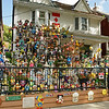 DOLL HOUSE: 
Toronto: This must be the final resting place where all those winning Ball Toss and Dart Throw carny-dolls go to when they come home from the circus midways. (What I have carefully concealed here is that this residence shrine is a duplex, that is a two family home. The other half of the property is "doll-free". Talk about neighbors from "H. E. Double Hockey Sticks" !
